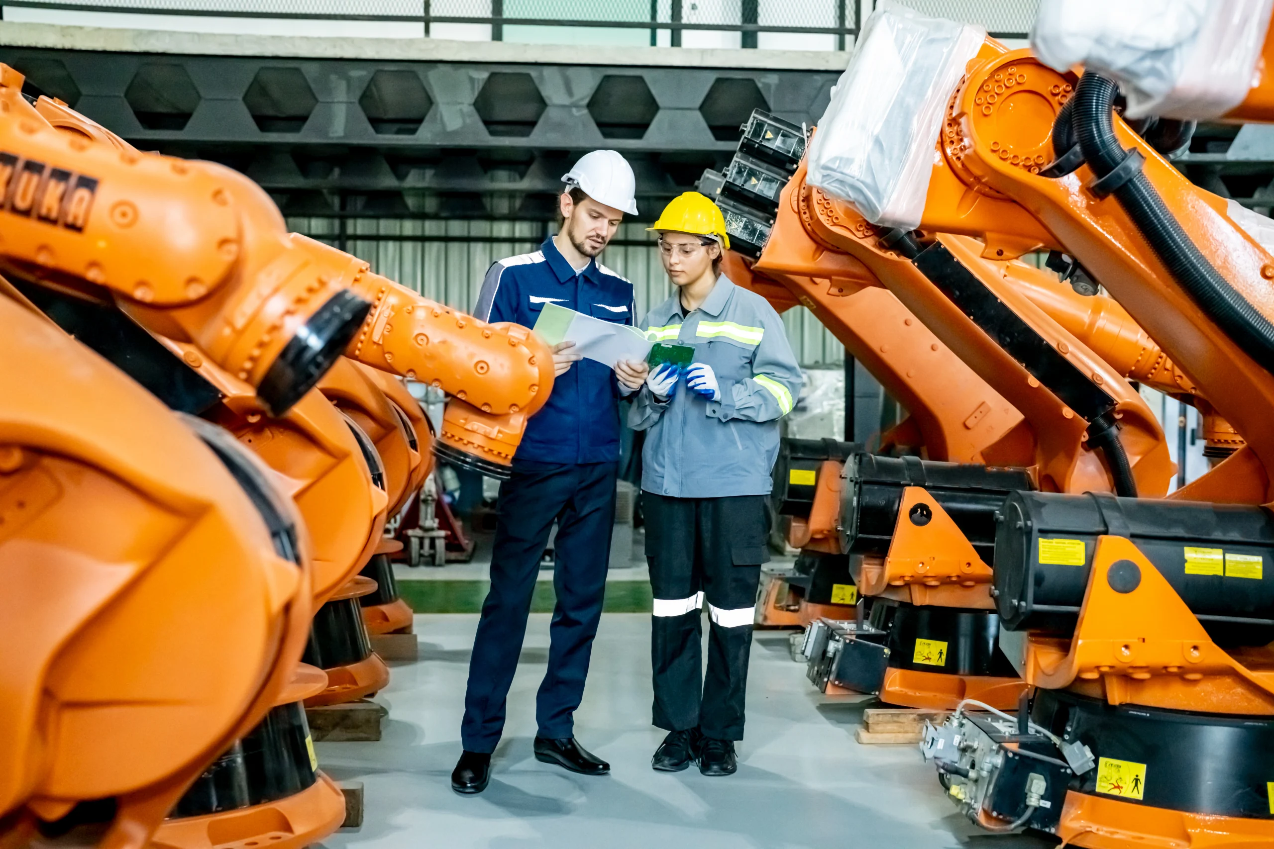 engineer-inspecting-automatic-ai-robot-arm-and-mac-2025-02-03-09-33-58-utc